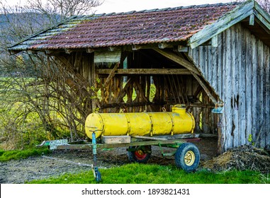 Old Water Container Trailer At A Field