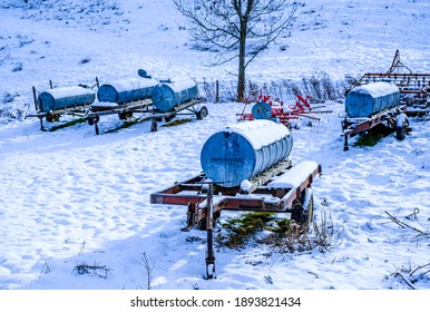 Old Water Container Trailer At A Field