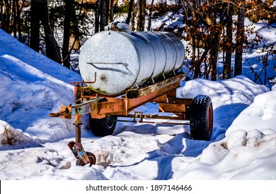 Old Water Container Trailer At A Field