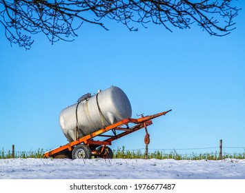 Old Water Container Trailer At A Field