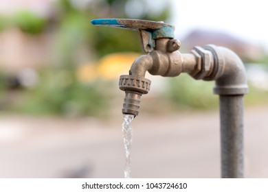 Old Water Tap Flowing Water Outside Stock Photo 1043724610 | Shutterstock