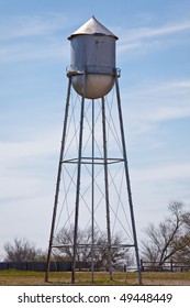 An Old Water Tower On A Farm