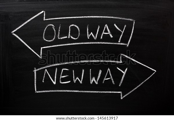 Old Way, New Way written on a blackboard with\
arrows pointing in the direction of the past and the future. A\
concept for adapting to change, improvement and development for the\
self or the business