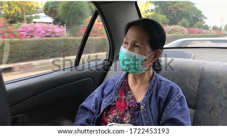 Old people’s wearing face mask protection her from Coronavirus Covid-19 in new normal lifestyle in travel and social distancing