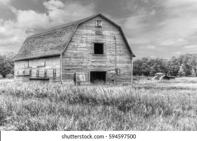 old weathered barn in black and white