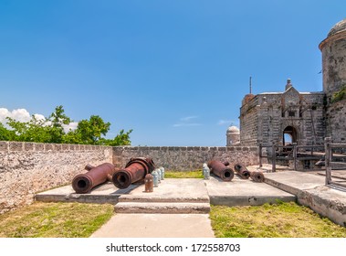 Old weathered cannons and shots exposition near the walls of Jagua fortress (Fortaleza de Jagua)