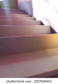 An Old Weathered Cement Staircase In The Back Hallway Of A Retro Apartment Building.