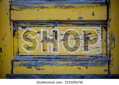 An Old Weathered Door To An Abandoned Shop