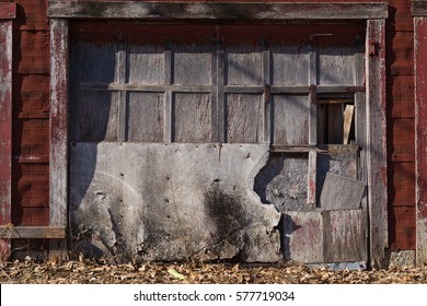 Old Weathered Garage Door In Small Midwest Town. 