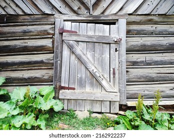 Old Weathered Gray Wooden Farm Barn Door