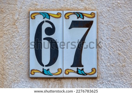 Old Weathered House Number 67, Tile on Wall
