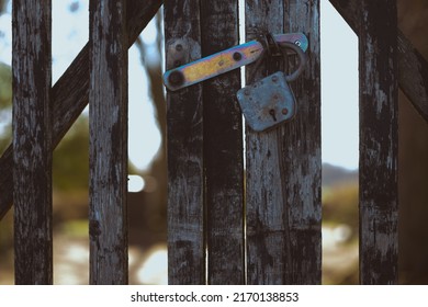 Old Weathered Locked Graveyard Gate In Latvia Cemetery