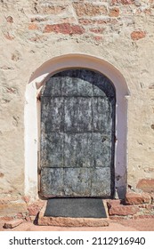 Old Weathered Metal Door On A Building.