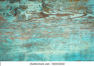 Old weathered plank painted in blue