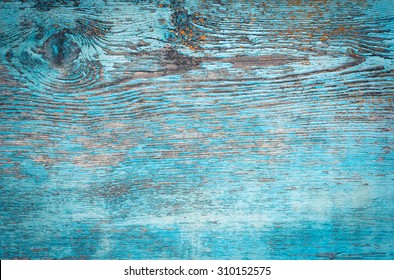 Old weathered plank painted in blue