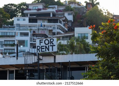 Old Weathered Sign For Rent In A Tourist Area Of A South Destination Vacation Town, Puerto Vallarta Mexico. Selective Focus. Immigration, Digital Nomads, Vacation, Travel Concept.