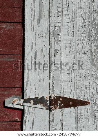 Old weathered vintage barn door hinge rusty metal aged antique texture background