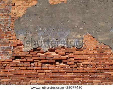 Old weathered wall with red multi-sized brick and a patched area.