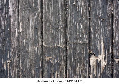 Old Weathered Wood Panel Background. Vintage Wallpaper. Aged Wood With Peeling Black Paint. 