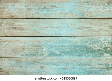 Old weathered wood plank painted in blue