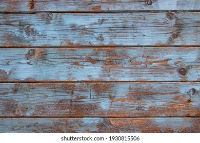 Old weathered wood plank texture with light blue paint for background with copy space