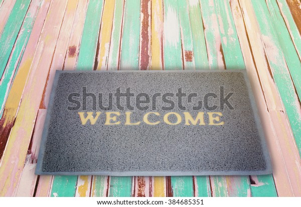 Old Welcome Doormat On Vintage Wooden Stock Photo Edit Now 384685351