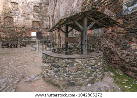 Old well in the courtyard of the ruins of the medieval Bolkow Castle in Lower Silesia, Poland