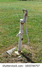 Old Well Pump In A Yard