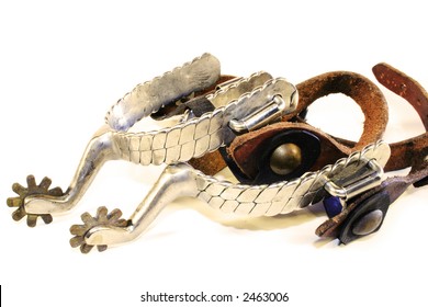 Old, well used spurs isolated on a white background.