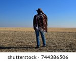 Old west cowboy on prairie