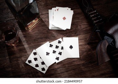 Old west poker. Dead man's hand. Two-pair poker hand consisting of the black aces and black eights, held by Old West gunfighter Wild Bill Hickok when he was murdered while playing a poker game.