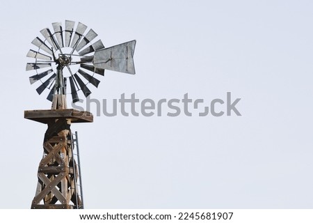 old western wooden windmill isolated