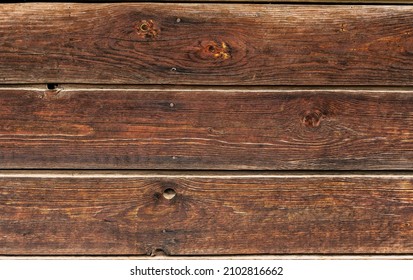 An old wheathered rustic braun dark oak wood texture. Boards with a knot. Grunge rough texture, wood texture. Naturally aged plank. - Shutterstock ID 2102816662