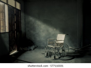 Old Wheelchair Was Forsaken In Old Room. This Is Lonely And Scary Concept And Halloween Theme