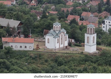 An Old White Church Building In A Town