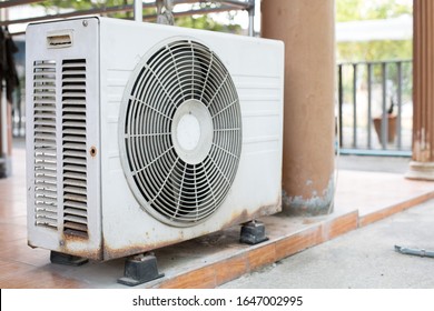 The old white compressor is outside the building - Shutterstock ID 1647002995