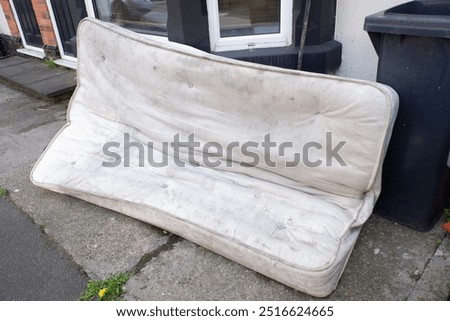 Similar – Image, Stock Photo Discarded mattress on the sidewalk in the light of a street lamp in front of an anonymous hotel façade