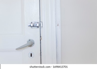 Old White Door And Wall, The Lock, Key, Door Handle And Scary Spider In Old Danish House