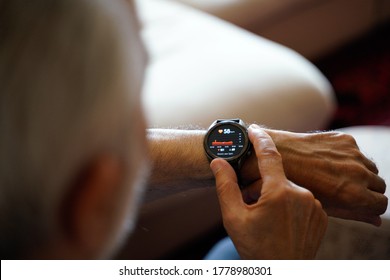 old white haired man using smart watch checking his cardiogram ecg - Shutterstock ID 1778980301