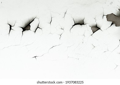 Old white paint on wall. Surface texture with cracked peeling paint. Close-up background. - Shutterstock ID 1937083225