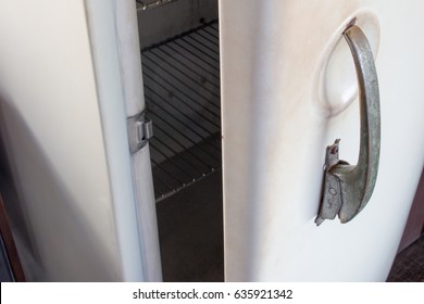 Old white vintage refrigerator door handle with copy space for text. Refrigerator handle concept. - Powered by Shutterstock