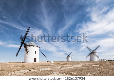 Old white windmills against a blue sky in Campo de Criptana, Castile la Mancha, Spain. Foto stock © 