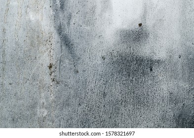 old whitewashed wall with cracks