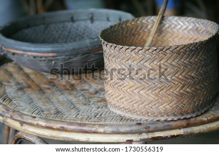 old wickerwork baskets on the wickerwork table