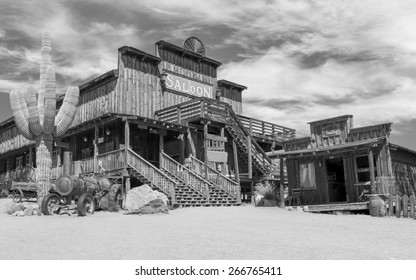 Old Wild West desert cowboy town with cactus and saloon in Black and White