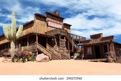 Old Wild West desert cowboy town with cactus and saloon 