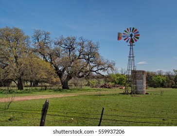 Old Windmill In A Cattle Pasture In West Texas With Water Tank For The Cattle