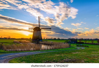 Old windmill farm in Holland landscape