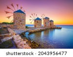 Old windmills by the beach, Chios island, Greece.
