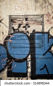 old window with graffiti